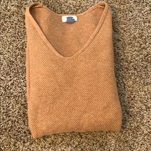 I’m selling a orange V-neck sweater for $15